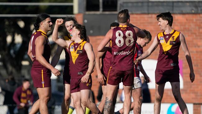 Dareo Rogers (second from the left) celebrates a last-quarter goal. Picture: Valeriu Campan