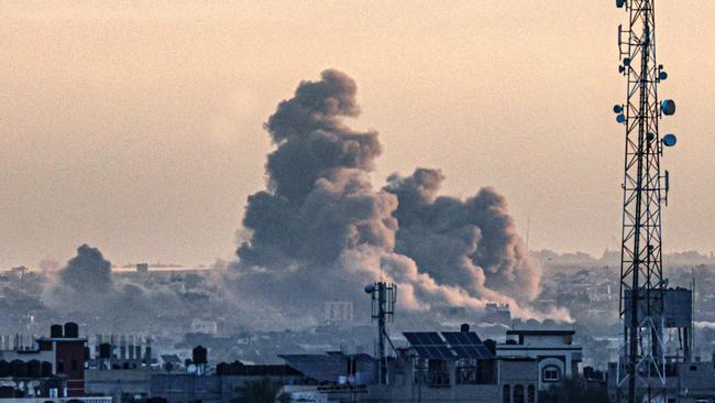 Smoke billows over Khan Younis in southern Gaza during Israeli bombardment as the war enters its 100th day Picture: AFP