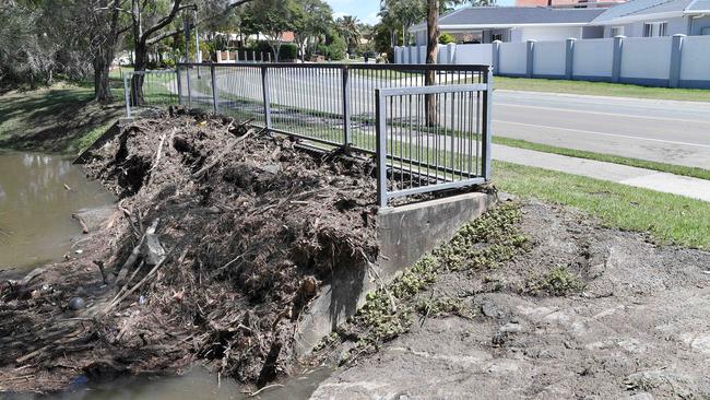 Debris are seen in a watercourse on Mary Pleasant Dr in Birkdale, Redland on Sunday. Picture: Patrick Woods.