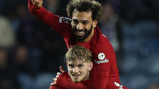 Harvey Elliott of Liverpool celebrates with teammate Mohamed Salah. Photo by Ian MacNicol/Getty Images.