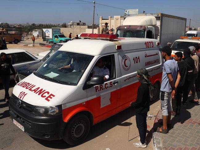 Ambulances carrying the bodies of staff members of aid group World Central Kitchen, arrive at the Rafah crossing with Egypt. Picture: AFP