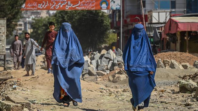 Afghan women walk along road under construction in Kabul. Picture: AFP