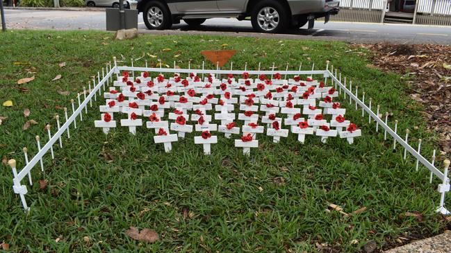 Small crosses on display in the grass at Yandina.