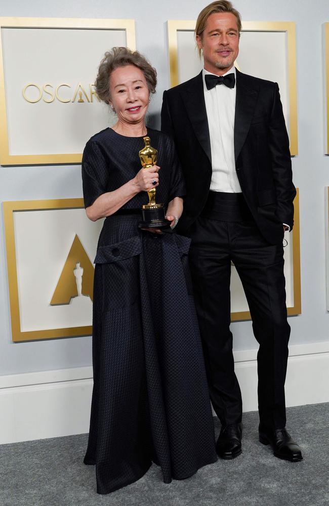 Brad Pitt, right, with Oscar winner Yuh-Jung Youn who won for her supporting role in Minari. Picture: AFP