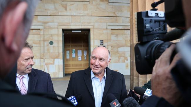 Former Renewal SA chief executive John Hanlon, centre, and his barrister David Edwardson QC, left, outside court. Picture: NCA NewsWire / David Mariuz.