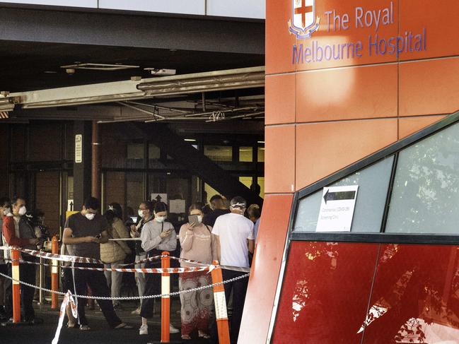 People queue at a coronavirus testing clinic at Royal Melbourne Hospital. Picture: Tony Gough