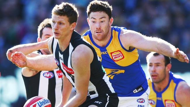 Will Hoskin-Elliott of the Magpies is closed down by Jeremy McGovern of the Eagles. Picture: Getty Images