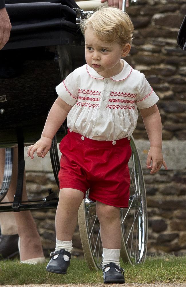 Britain’s Prince George stands with his parents as they leave after attending the Christening of his sister Princess Charlotte at St. Mary Magdalene Church in Sandringham, England, Sunday, July 5, 2015. Picture: AP