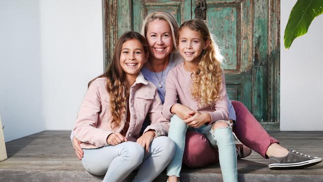 Belinda Hokins, with daughters Evie and Mia, wants religious instruction to be modernised in classrooms. Picture: Nigel Hallett