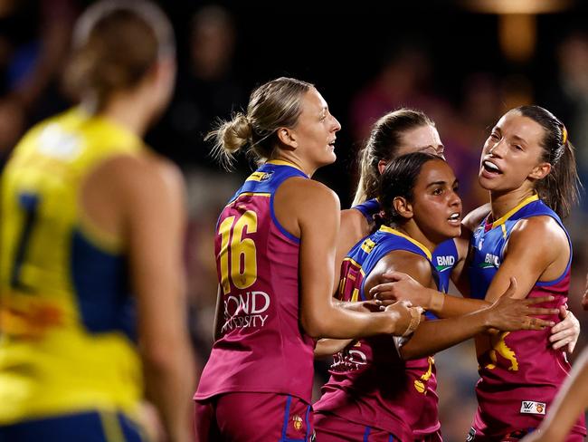 BRISBANE, AUSTRALIA - NOVEMBER 23: (L-R) Evie Long, Courtney Hodder and Jade Ellenger of the Lions celebrate during the 2024 AFLW Second Preliminary Final match between the Brisbane Lions and the Adelaide Crows at Brighton Homes Arena on November 23, 2024 in Brisbane, Australia. (Photo by Michael Willson/AFL Photos via Getty Images)