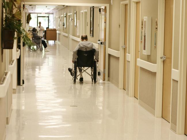 man in wheelchair in aged care nursing home Istock 000001329263large