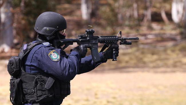 Officers in training with the high-powered weapons.