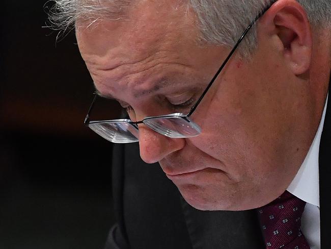 CANBERRA, AUSTRALIA - MARCH 23: Prime Minister Scott Morrison during Question Time in the House of Representatives at Parliament House on March 23, 2021 in Canberra, Australia. The federal government was yesterday set back by new allegationsÃÂ broadcastÃÂ by the Ten Network after pixelated images of unnamed Coalition advisers allegedly engaging in performing lewd sex acts on the desks of female MPs resulting in a Morrison staff member being sacked last night. Additionally, the ABC Network aired a first hand account by an Australian Parliament security guard of what she witnessed on the night Brittany Higgins was allegedly raped in the office of then-defence industry minister Linda Reynolds in early 2019. (Photo by Sam Mooy/Getty Images)