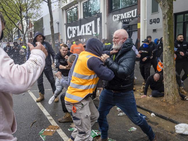 Men brawl outside the CFMEU headquarters during a protest about mandatory vaccination in the construction industry. Picture: David Geraghty