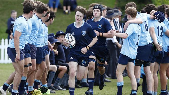 Brisbane Grammar School captain Ryan Shaw leads his team on last weekend. Photo: Tertius Pickard