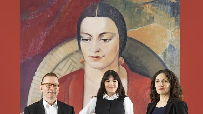 Wayne Tunnicliffe, head of Australian art, Art Gallery of New South Wales, Elle Freak, associate curator of Australian art, Art Gallery of South Australia, and Tracey Lock, curator of Australian art, Art Gallery of South Australia, with an image of Grace Crowley’s Miss Gwen Ridley, 1930. Picture: Saul Steed.