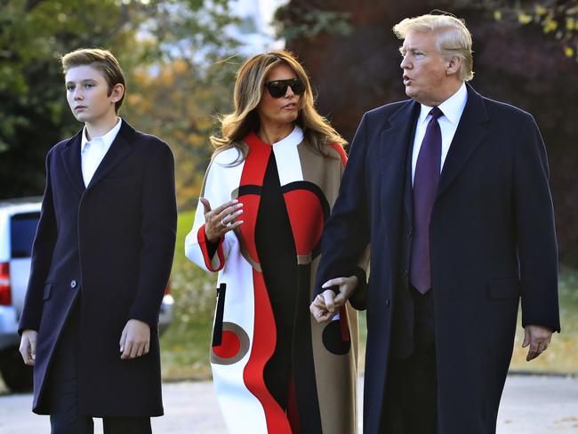 President Donald Trump and first lady Melania Trump with their son Barron Trump talk as they walk on the South Lawn of the White House in Washington, Tuesday, Nov. 20, 2018, to board the Marine One. Trump and his family are traveling to Florida, where they will spend Thanksgiving at Mar-a-Lago. (AP Photo/Manuel Balce Ceneta)