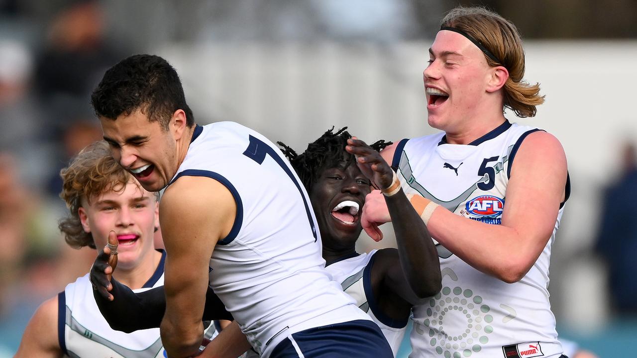 Luamon Lual, Harley Reid and Joel Freijah enjoy a Vic Country goal. Picture: Morgan Hancock/AFL Photos via Getty Images