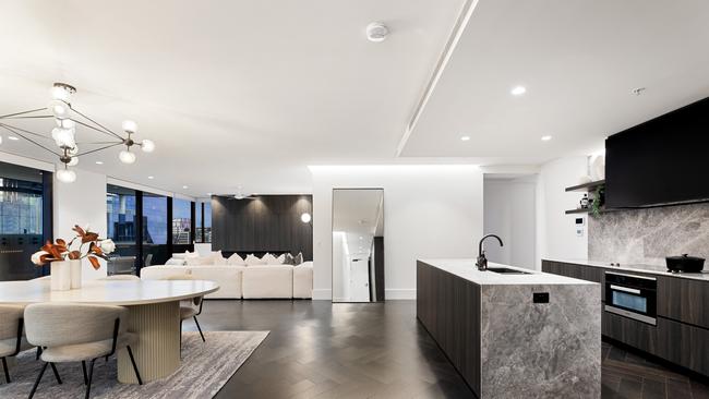 The kitchen and dining area in one of Chester &amp; Ella's penthouses, which are for sale. Image supplied by Kokoda Property.