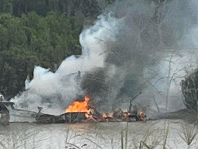 Watch: Boat destroyed by fire moored in the Mary River