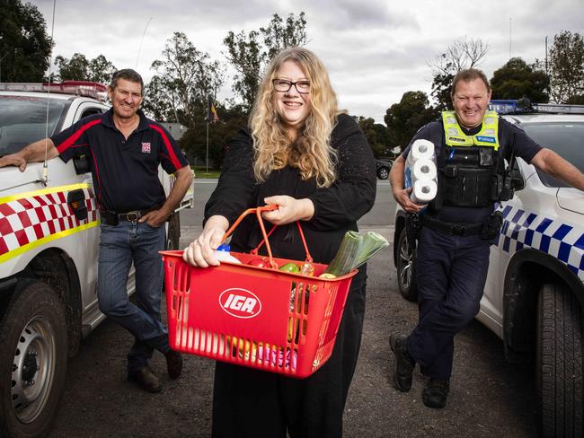 Violet Town has a delivery squad, taking groceries and iPads to those in their community who need help at the moment. CFA Captain Jeffery Jennings, Annette Walton and Leading Senior Constable Patrick Storer. Picture- Nicole Cleary