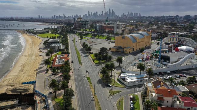 St Kilda beach and Luna Park lie deserted on the first day of Victoria’s fourth coronavirus lockdown. Picture: Alex Coppel.