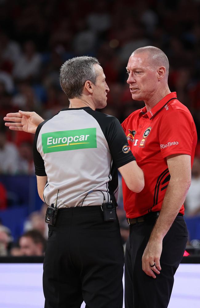 Referee Vaughan Mayberry talks with John Rillie, head coach of the Wildcats. Picture: Getty Images