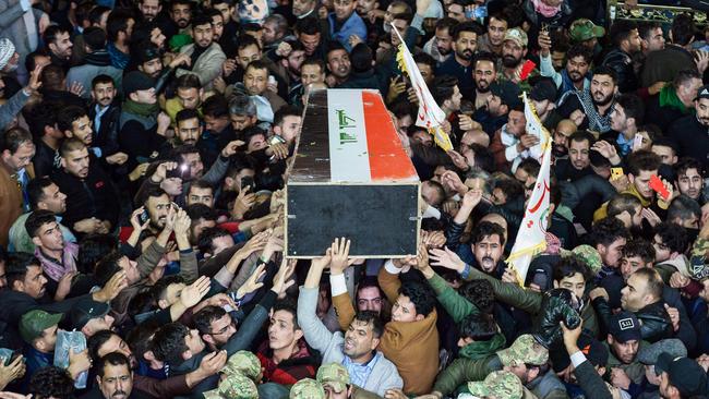 Mourners carry the coffin of slain Iraqi paramilitary chief Abu Mahdi al-Muhandis in Najaf in central Iraq. Muhandis also died in the strike on Soleimani. Picture: AFP