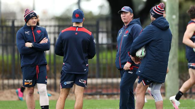 SYDNEY, AUSTRALIA - JUNE 22: James Tedesco, Boyd Cordner and Josh Morris speak to coach Trent Robinson during a Sydney Roosters NRL training session at Kippax Lake on June 22, 2020 in Sydney, Australia. (Photo by Mark Kolbe/Getty Images)