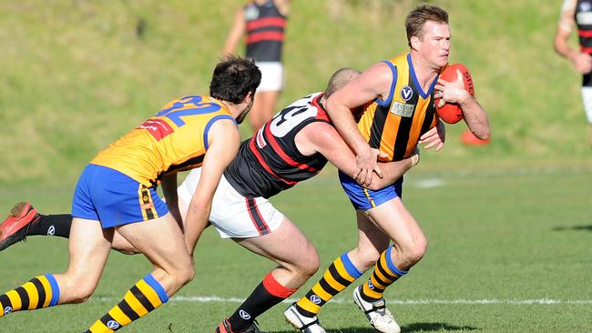 St Bernard’s Tim Harvey tries to evade a tackle.