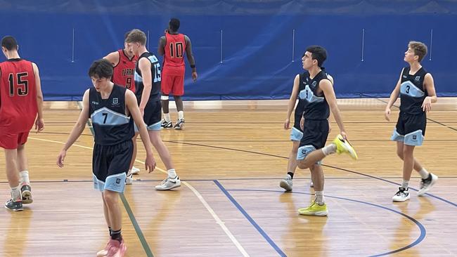 Lebron Brooks at the free throw line and Lachlan Curtin on the left in jersey No.7.