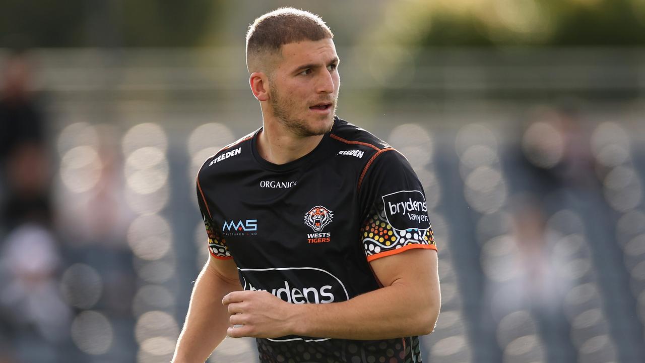 SYDNEY, AUSTRALIA - AUGUST 07: Adam Doueihi of the Wests Tigers warms up during the round 21 NRL match between the Wests Tigers and the Newcastle Knights at Campbelltown Stadium, on August 07, 2022, in Sydney, Australia. (Photo by Cameron Spencer/Getty Images)