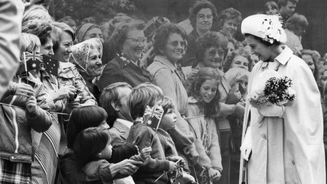 Queen Elizabeth stops to talk to a group of children on her Rundle Mall walk during the Adelaide leg of her Jubilee royal tour in 1977. Picture: Neon Martin.