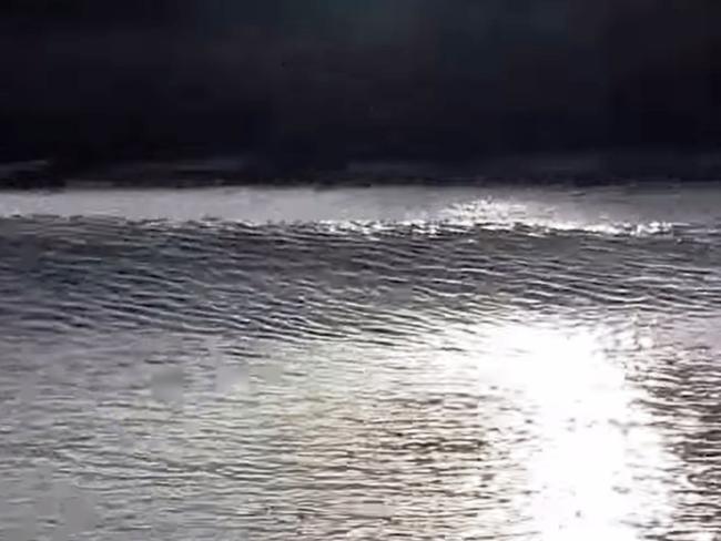 A group of fishos captured the moment their boat was hit by a tidal bore in the Daly last week. The wave broke right on top of them. They were on a Darwin Barra and Crab charter. Picture: Carl Skyring