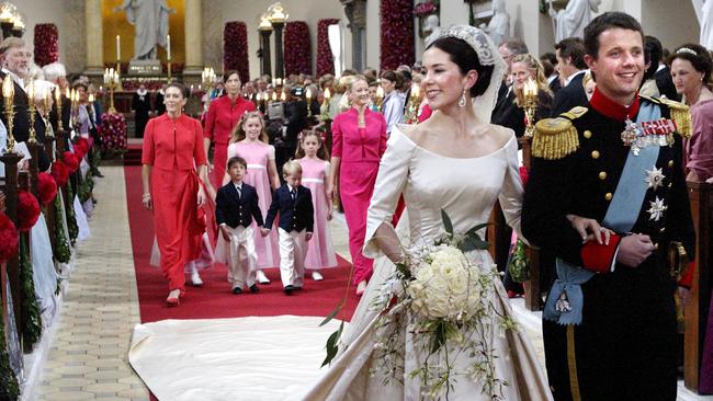 Crown Prince Frederik of Denmark and Australian born Crown Princess Mary Donaldson of Australia, walk down aisle.