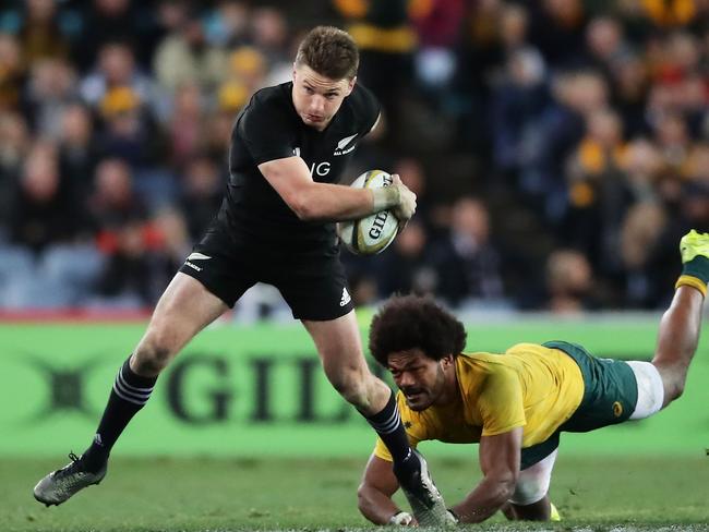 Beauden Barrett escapes the clutches of Henry Speight.