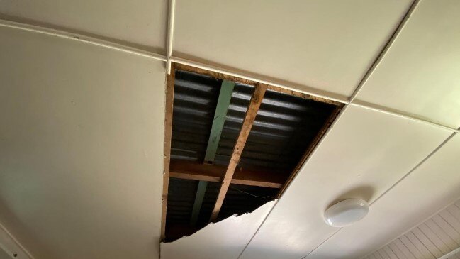 The gaping hole left in the Dayboro kitchen ceiling by the snakes.