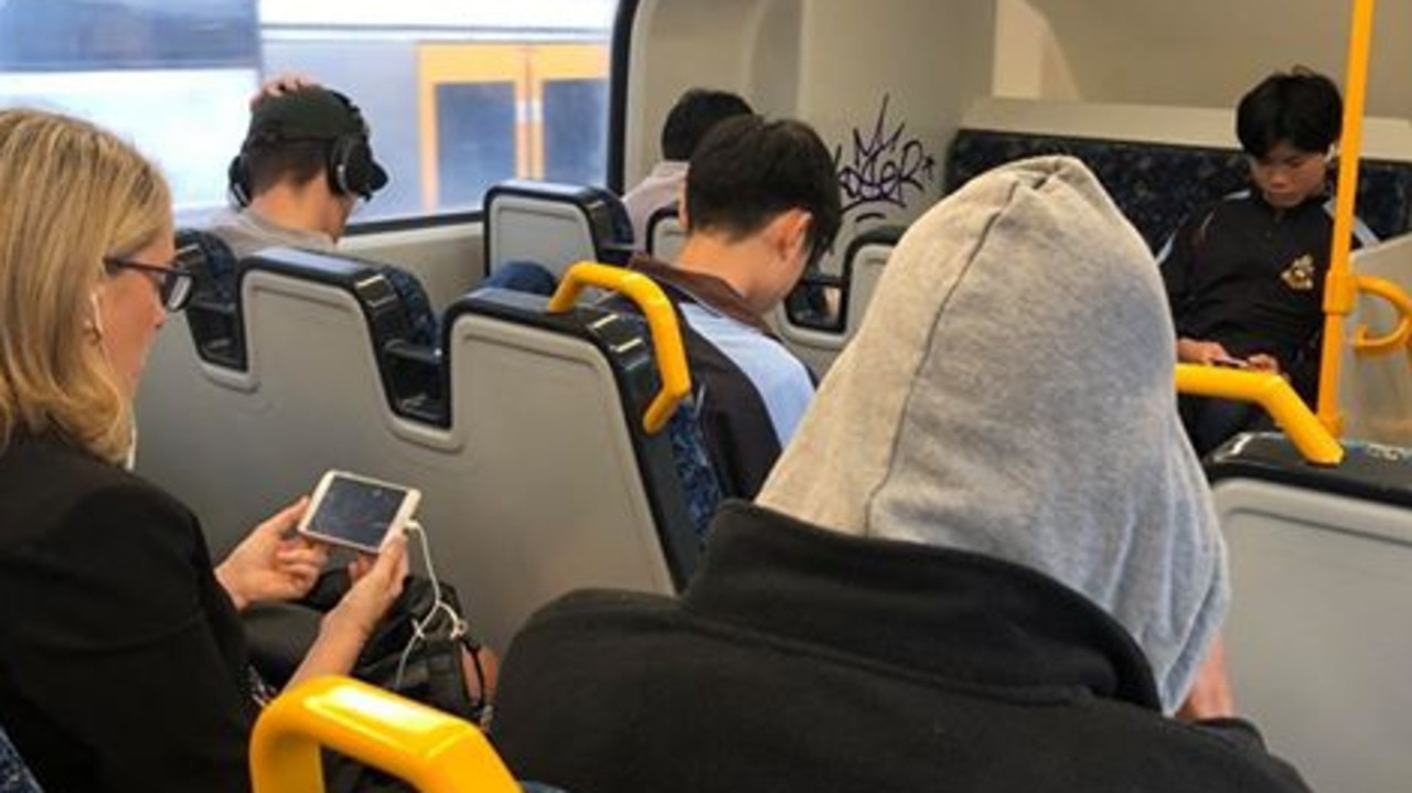 Picture supplied from a Daily Telegraph reader shows commuters ignoring new green dots on the Cronulla-to-city train line in Sydney. Picture: Supplied