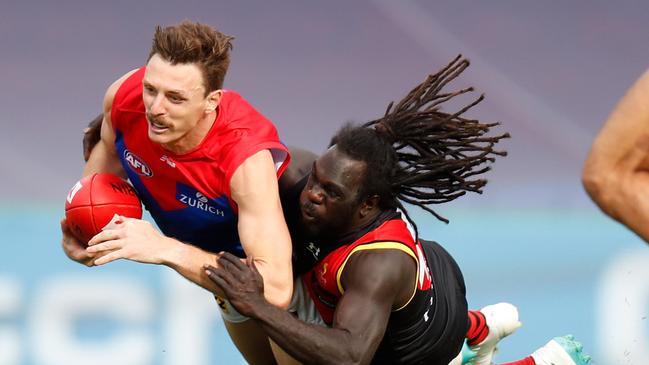 Anthony McDonald-Tipungwuti lays a rundown tackle on Jake Lever. Picture: Michael Willson/Getty Images