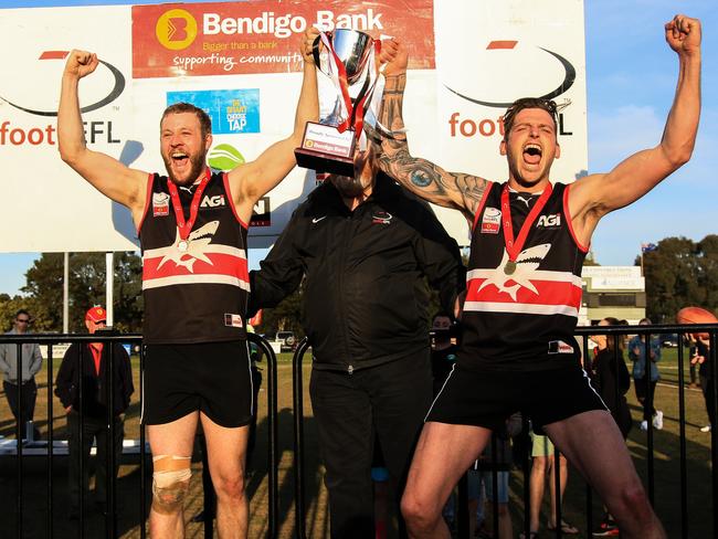 Jarrod Bayliss lifts the EFL Division 3 2017 premiership with captain Tom Feher. Picture: Davis Harrigan