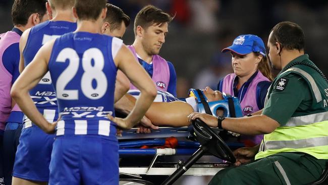 Higgins was carried off the ground on a stretcher following the incident. Picture: Getty Images