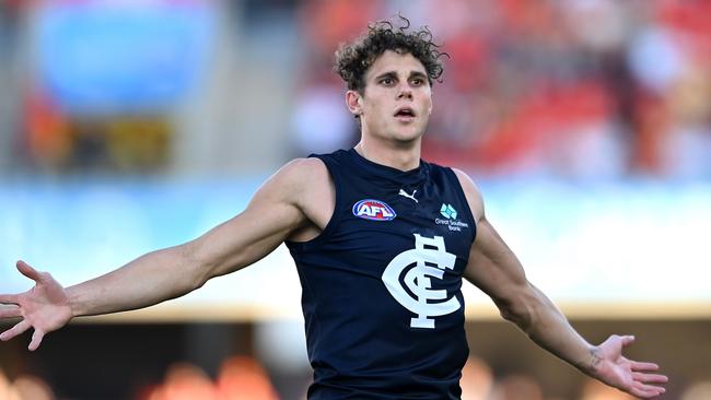 GOLD COAST, AUSTRALIA - AUGUST 19: Charlie Curnow of the Blues celebrates kicking a goal during the round 23 AFL match between Gold Coast Suns and Carlton Blues at Heritage Bank Stadium, on August 19, 2023, in Gold Coast, Australia. (Photo by Albert Perez/AFL Photos via Getty Images)