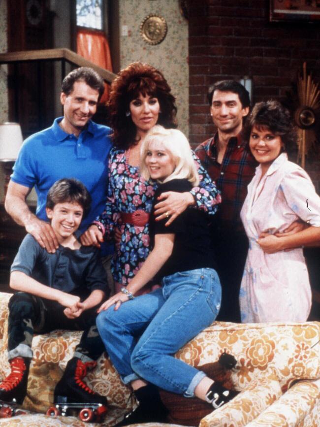 Applegate (centre, bottom) in Married … with Children circa 1996.