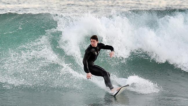 Patrick Dangerfield surfs to get away from the pressures of football. Picture: Nigel Hallett