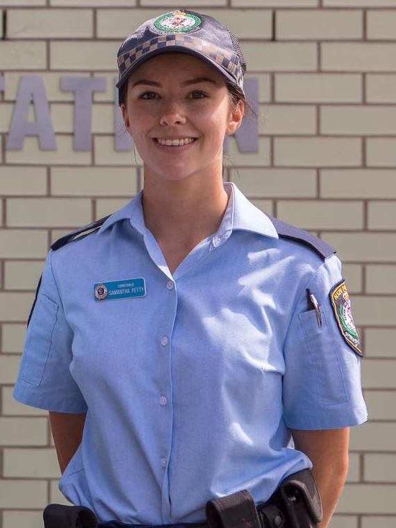 Probationary Constable Samantha Petty has been hailed a hero after dragging Snr Cst McMurtrie behind a police paddy wagon after she was shot.