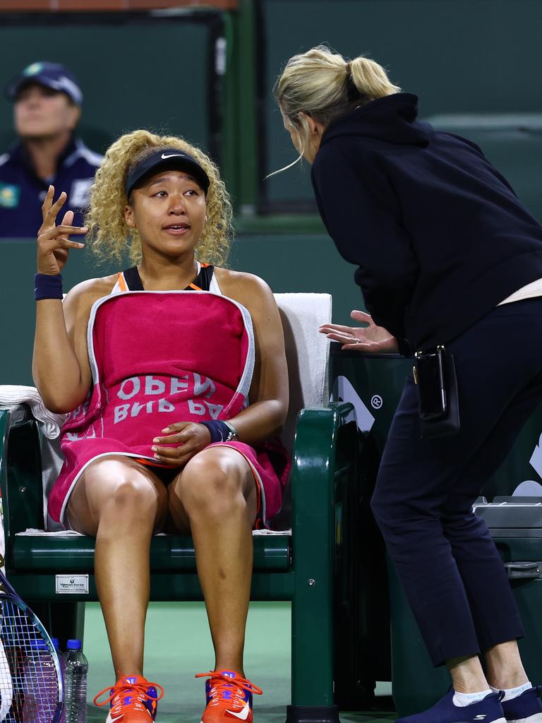 Naomi Osaka of Japan speaks with the WTA supervisor Clare Wood after play was disrupted by a heckler. Photo: Clive Brunskill/Getty Images/AFP