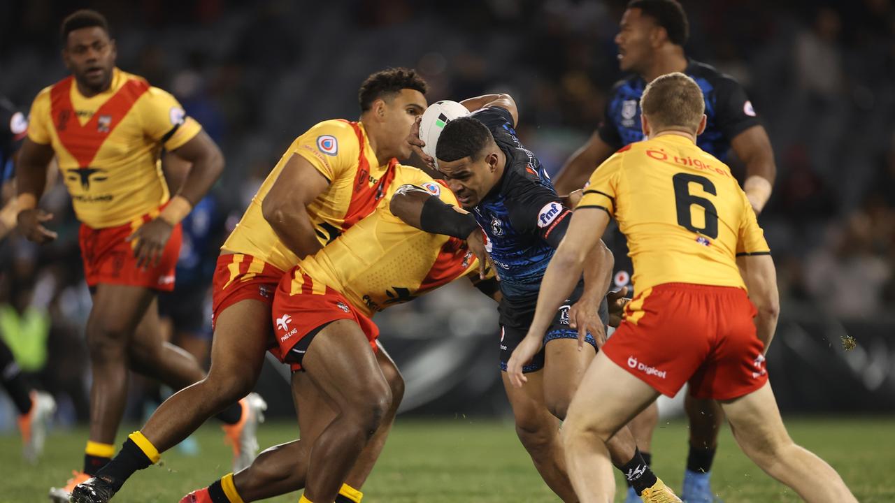 SYDNEY, AUSTRALIA - JUNE 25: Penioni Tagituimua of Fiji is tackled during the Men's International Test Match between Papua New Guinea and Fiji at Campbelltown Sports Stadium on June 25, 2022 in Sydney, Australia. (Photo by Mark Kolbe/Getty Images)