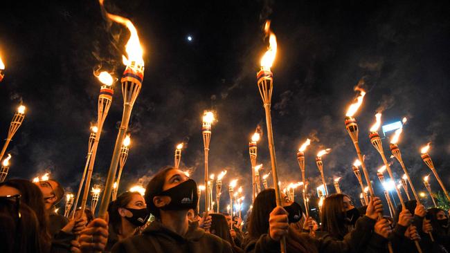 Armenians take part in a torchlight procession in Yerevan to mark the 106th anniversary of World War I-era mass killings.