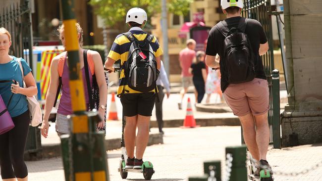 Lime scooters being ridden in Brisbane’s CBD. Photo: Lyndon Mechielsen