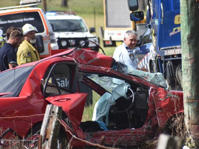 Multiple emergency services crews attended the scene after a red sedan Mitsubishi Lancer sedan crashed into a power pole on Rogans Bridge Rd north of Waterview Heights on Thursday, 18th February, 2021. Photo Bill North / The Daily Examiner